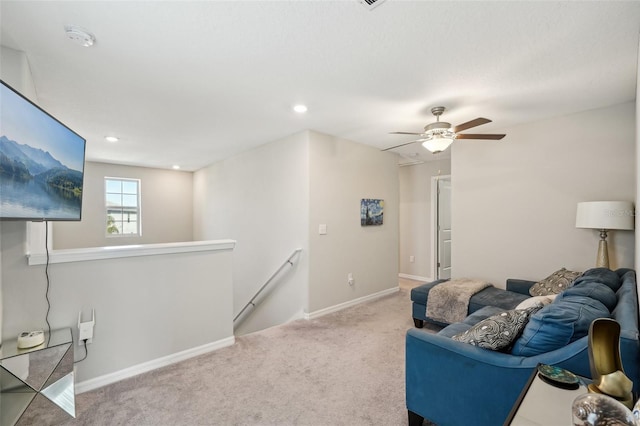 carpeted living room featuring recessed lighting, baseboards, and ceiling fan