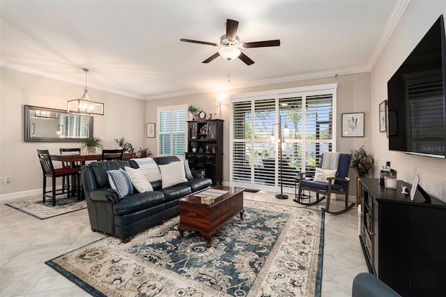 living room featuring ceiling fan with notable chandelier, crown molding, and baseboards