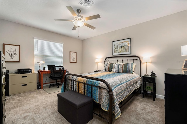 bedroom with visible vents, light carpet, baseboards, and ceiling fan