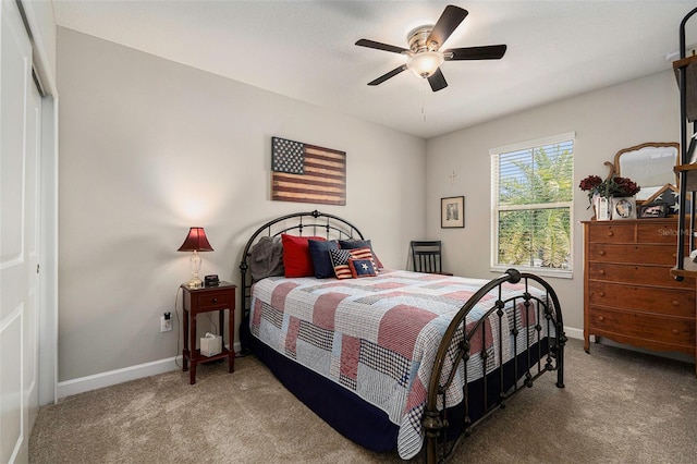 bedroom featuring ceiling fan, baseboards, and carpet floors