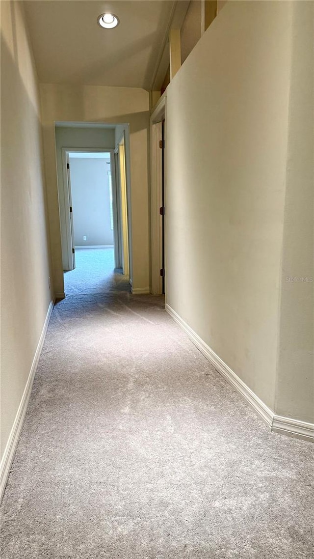 hall with recessed lighting, baseboards, and carpet floors