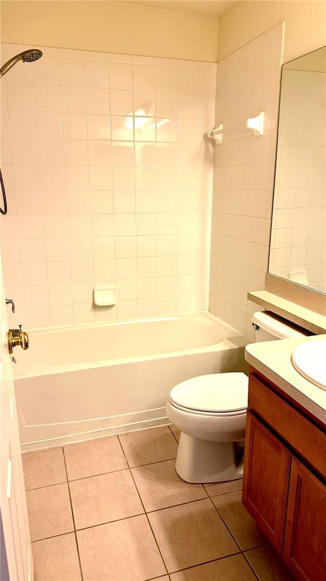 bathroom with vanity, tile patterned floors, toilet, and shower / tub combination