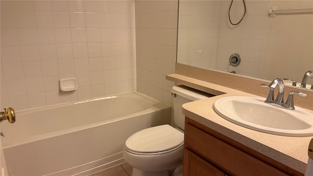 bathroom with vanity, toilet, and bathtub / shower combination