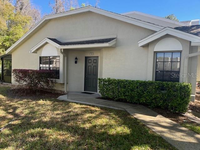 5100 Burchette Rd Unit 500, Tampa, FL 33647 - view of front of property with a front lawn and stucco siding