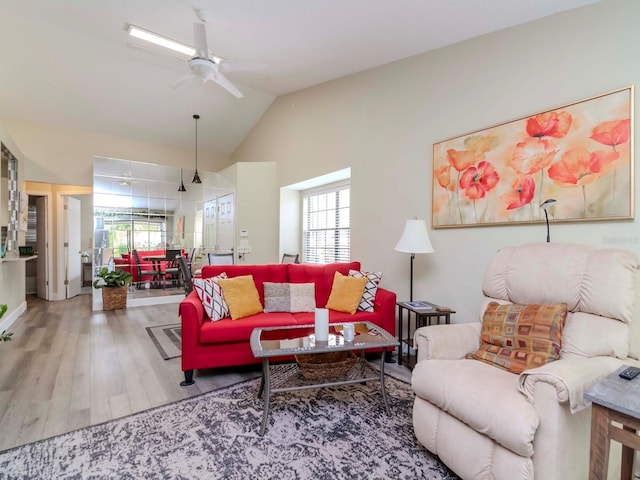 5100 Burchette Rd Unit 500, Tampa, FL 33647 - living room with vaulted ceiling, wood finished floors, and a ceiling fan