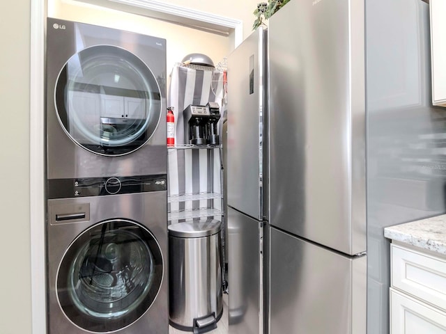 5100 Burchette Rd Unit 500, Tampa, FL 33647 - washroom featuring stacked washer and clothes dryer and laundry area