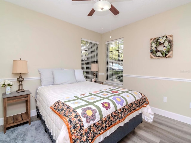5100 Burchette Rd Unit 500, Tampa, FL 33647 - bedroom with wood finished floors, a ceiling fan, and baseboards
