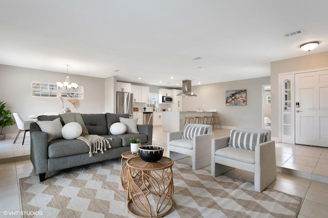 living room featuring visible vents, recessed lighting, light tile patterned floors, baseboards, and a chandelier