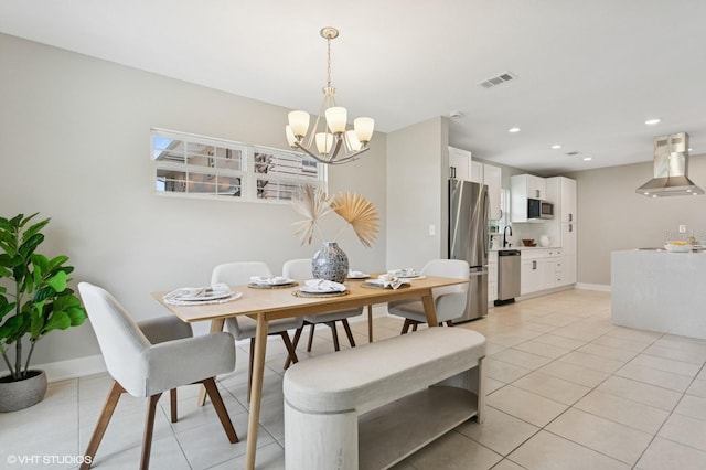 dining room featuring light tile patterned floors, visible vents, baseboards, and a notable chandelier