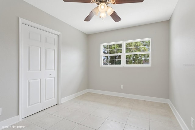 interior space featuring a ceiling fan and baseboards