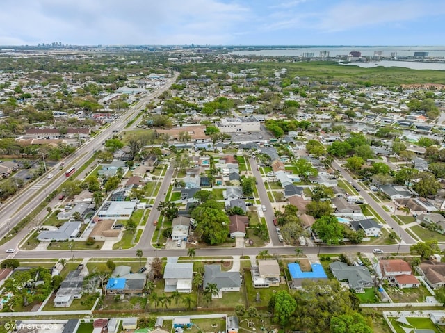 drone / aerial view featuring a residential view and a water view