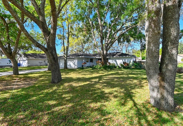 view of yard featuring an attached garage