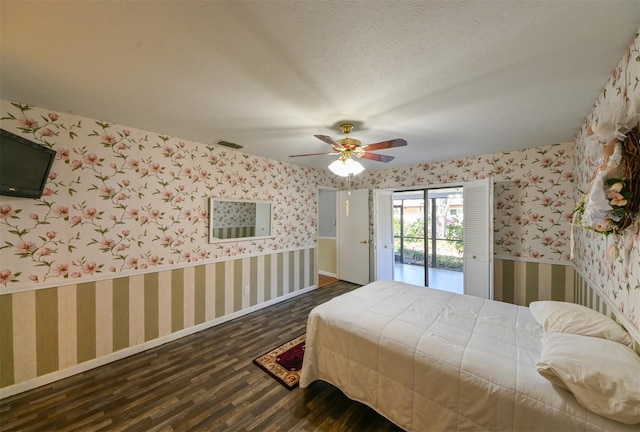 bedroom featuring wallpapered walls, access to exterior, dark wood-style floors, and visible vents