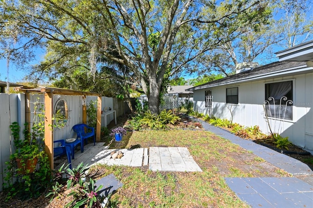 view of yard with a patio and a fenced backyard