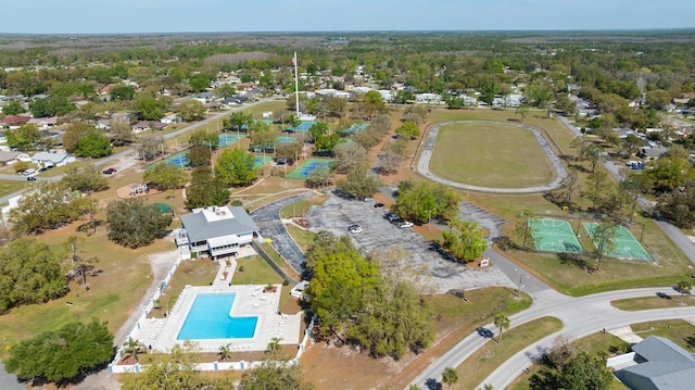 birds eye view of property with a wooded view