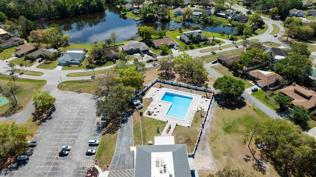 drone / aerial view with a residential view and a water view