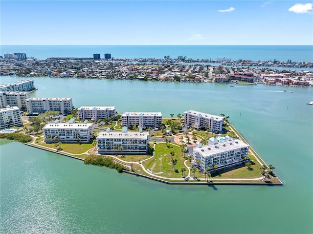 birds eye view of property with a water view and a view of city