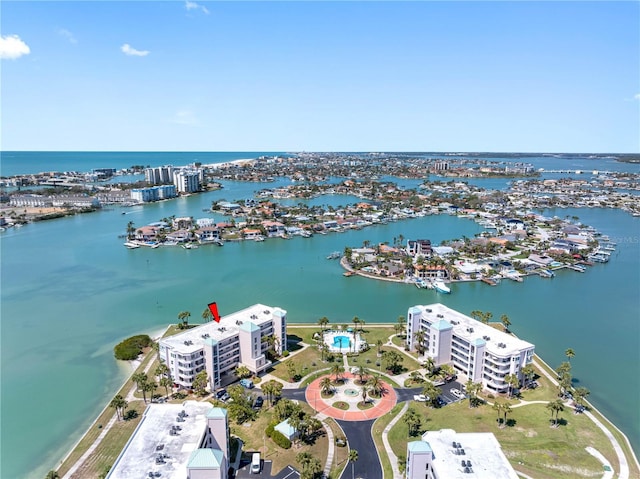 birds eye view of property with a water view and a view of city