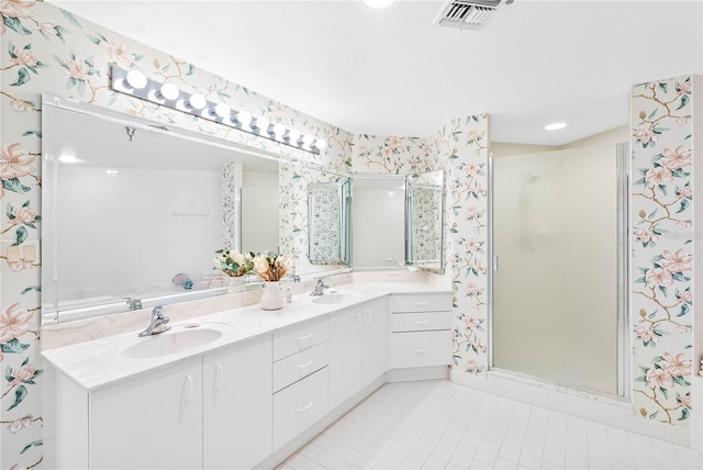 full bath featuring a sink, visible vents, a stall shower, and wallpapered walls