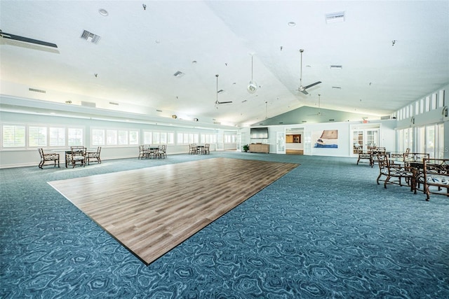 miscellaneous room featuring visible vents, carpet flooring, a ceiling fan, and vaulted ceiling