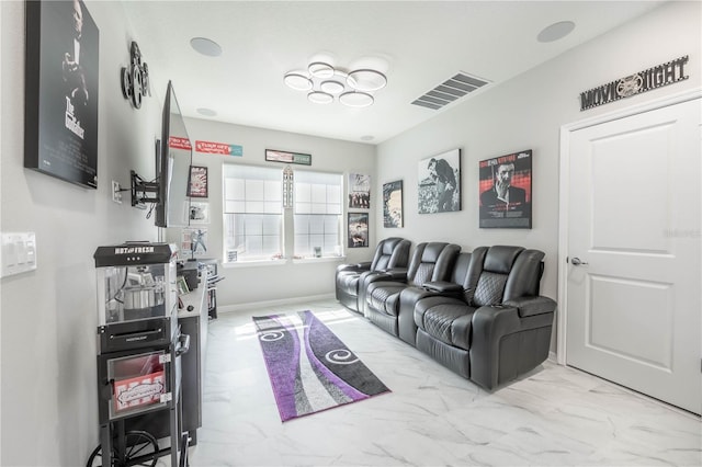 living room with visible vents, marble finish floor, and baseboards