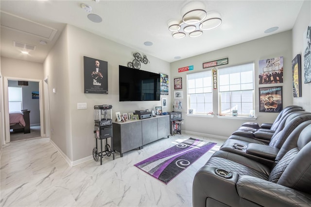 living room featuring visible vents, baseboards, and marble finish floor