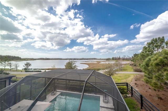 outdoor pool with a water view and a lanai