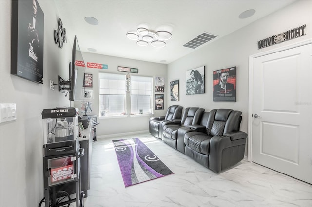 living room featuring marble finish floor, baseboards, and visible vents