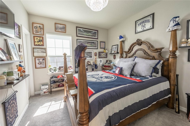bedroom with baseboards, a notable chandelier, and light colored carpet
