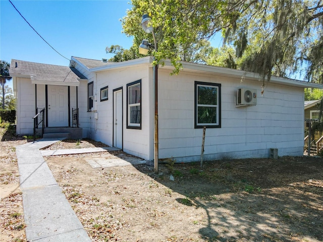 view of front of property with ac unit