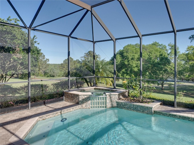 view of pool featuring a pool with connected hot tub and a lanai