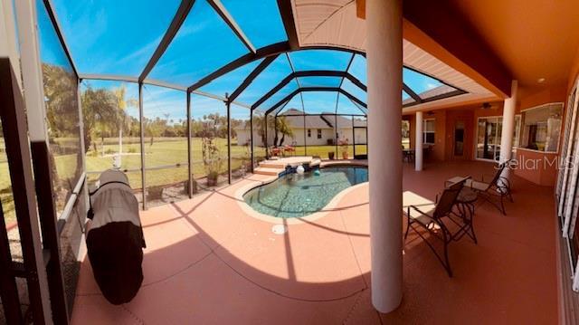 pool with a patio area and a lanai