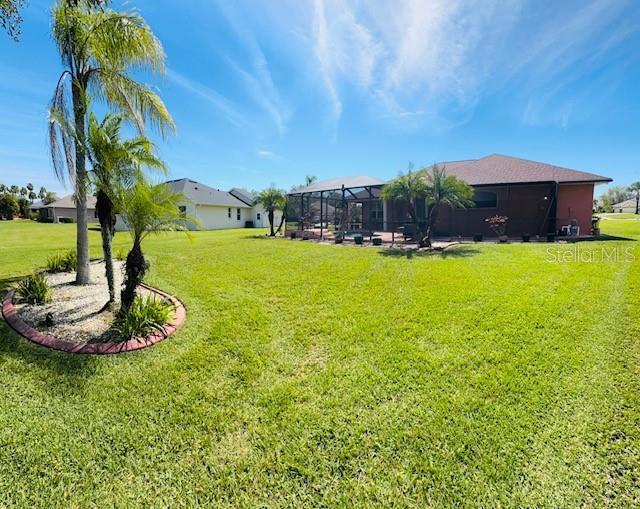 view of yard featuring glass enclosure