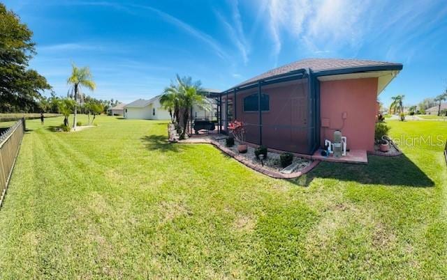 view of yard with a lanai