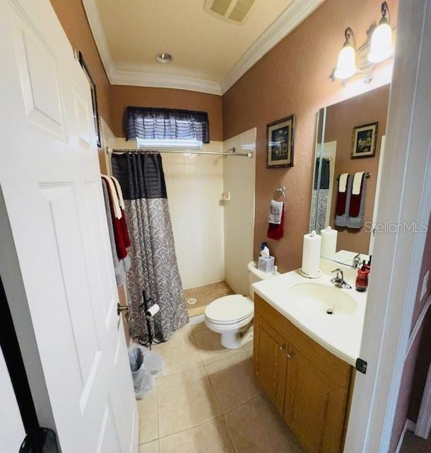 full bath featuring vanity, a stall shower, crown molding, toilet, and tile patterned floors