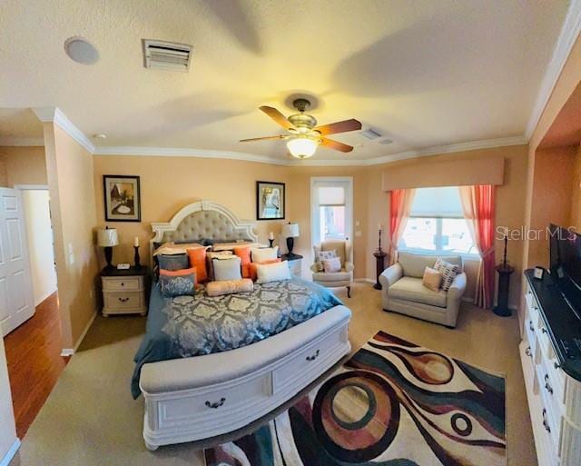 bedroom with visible vents, baseboards, ceiling fan, and crown molding