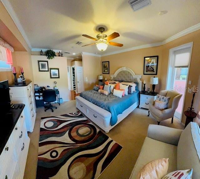 bedroom featuring carpet, visible vents, and ornamental molding