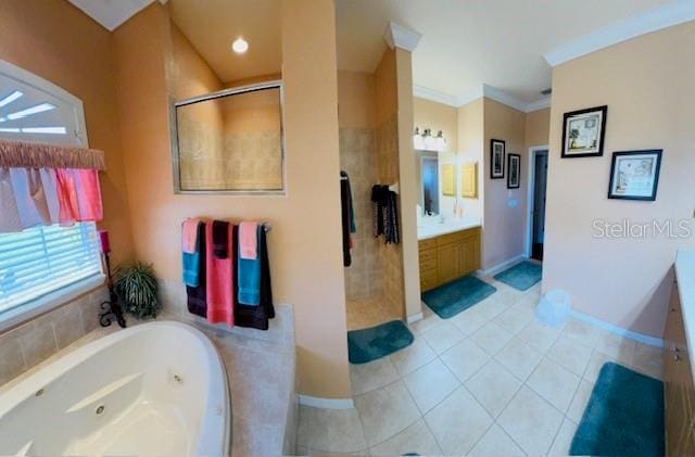 full bathroom featuring tile patterned floors, ornamental molding, a jetted tub, a shower stall, and vanity