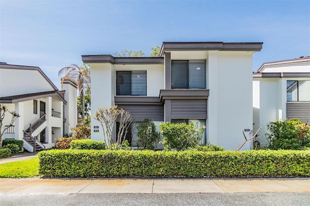 contemporary house with stucco siding