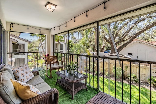 sunroom featuring track lighting