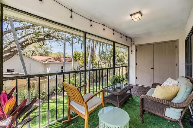 sunroom featuring track lighting