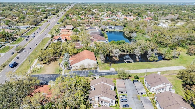 birds eye view of property with a residential view and a water view