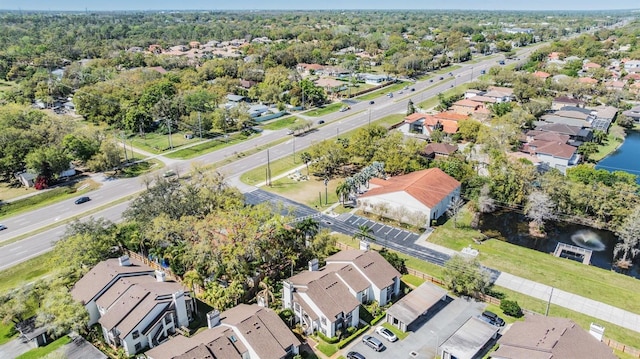 bird's eye view featuring a residential view and a water view