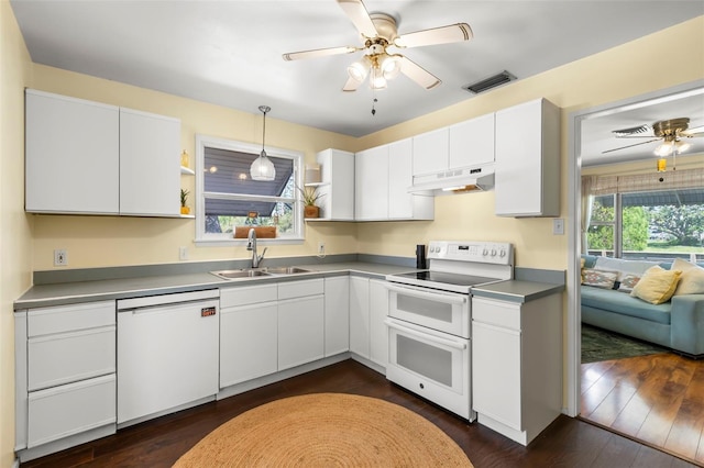 kitchen featuring visible vents, a ceiling fan, under cabinet range hood, a sink, and white appliances