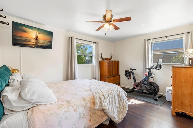 bedroom with dark wood finished floors and ceiling fan