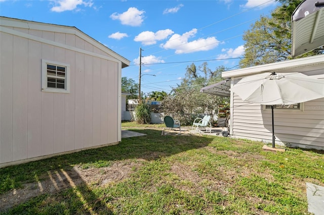 view of yard with a patio and central AC unit