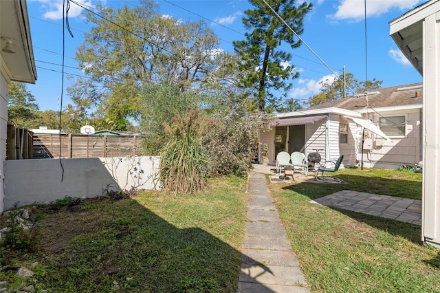 view of yard with a patio area and fence