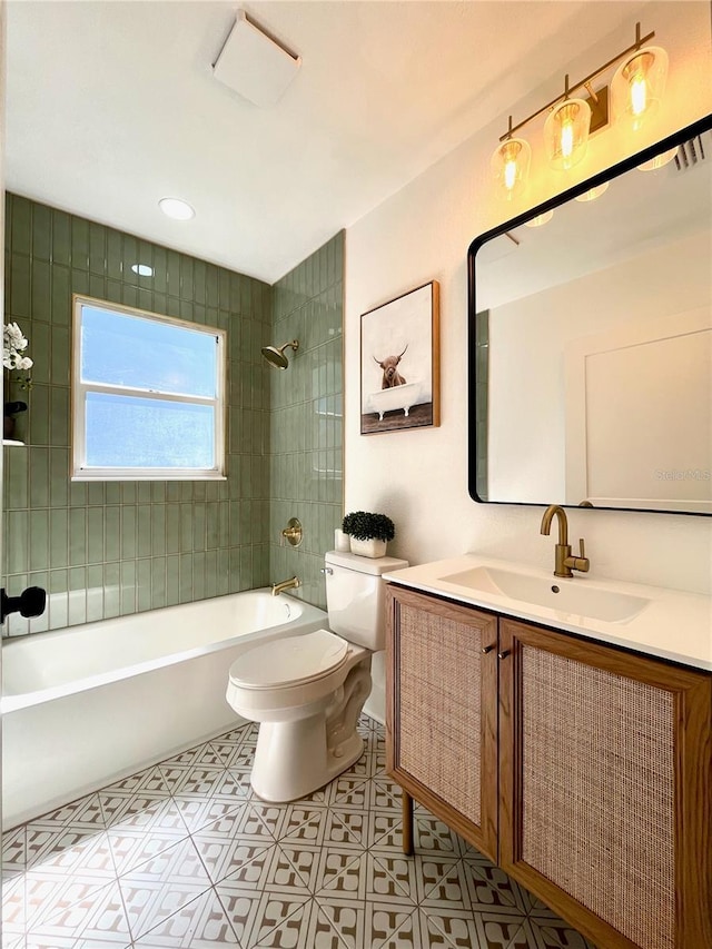 bathroom featuring vanity, toilet, and  shower combination