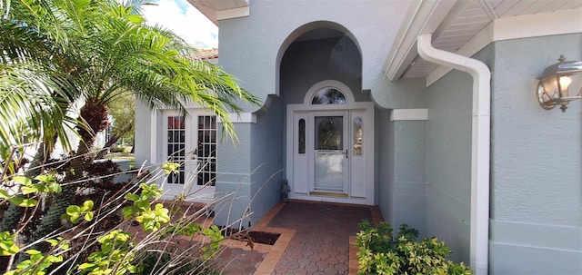 7279 Maidencane Ct, Seminole, FL 33777 - property entrance with french doors and stucco siding