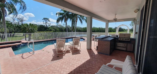 7279 Maidencane Ct, Seminole, FL 33777 - view of swimming pool with a fenced in pool, fence, an outdoor kitchen, a ceiling fan, and a patio